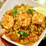 Keto Jambalaya with Cauliflower Rice in a bowl with a lemon wedge