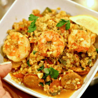 Keto Jambalaya with Cauliflower Rice in a bowl with a lemon wedge