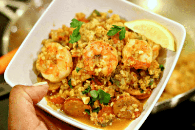 Keto Jambalaya with Cauliflower Rice in a bowl with a lemon wedge