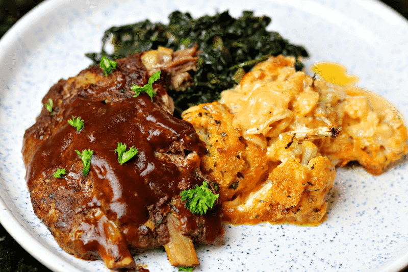 Keto Ribs with Cauliflower Mac and Cheese on a plate