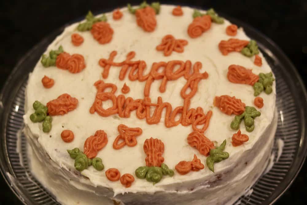 A picture of the Best Low Carb Carrot Cake with birthday decorations