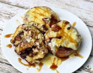 three keto maple pecan cinnamon rolls on a plate