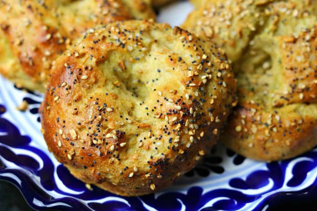 Three keto bagels on a blue plate