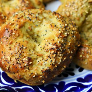 Three keto bagels on a blue plate