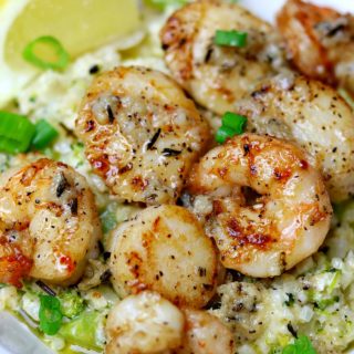 Seared Scallops & Cauliflower Rice Risotto with Shrimp in a bowl