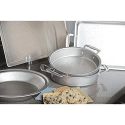 a lifestyle photo of 360 cookware baking set with two cake pans, a pie pan, and baking sheet