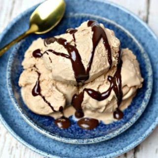 Three scoops of chocolate peanut butter ice cream in a blue bowl