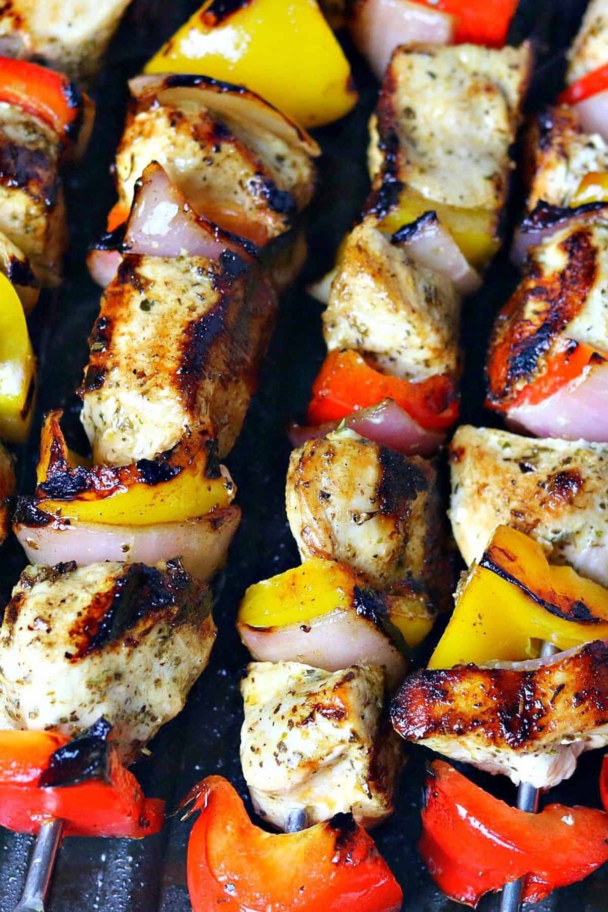 chicken kabobs on a cast iron grill pan immediately after cooking