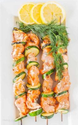 A close up of grilled Salmon Kabobs with Lemon Dill Marinade on a plate