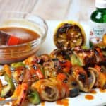 Bacon Wrapped BBQ Chicken Kabobs on a plate with SweetLeaf Sweet Drops