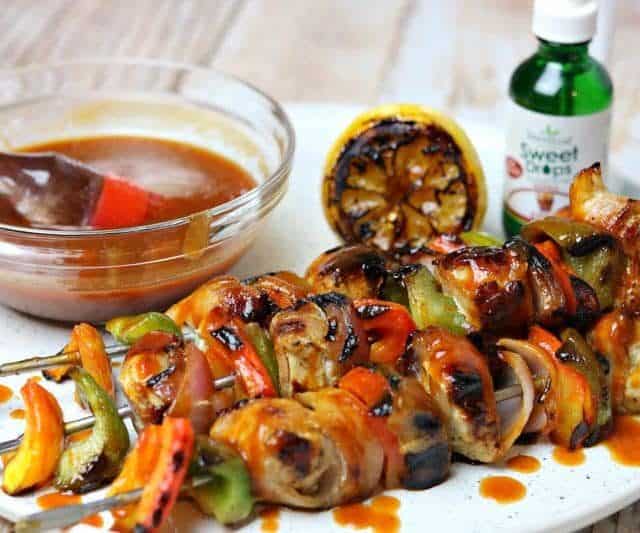 Bacon Wrapped BBQ Chicken Kabobs on a plate with SweetLeaf Sweet Drops