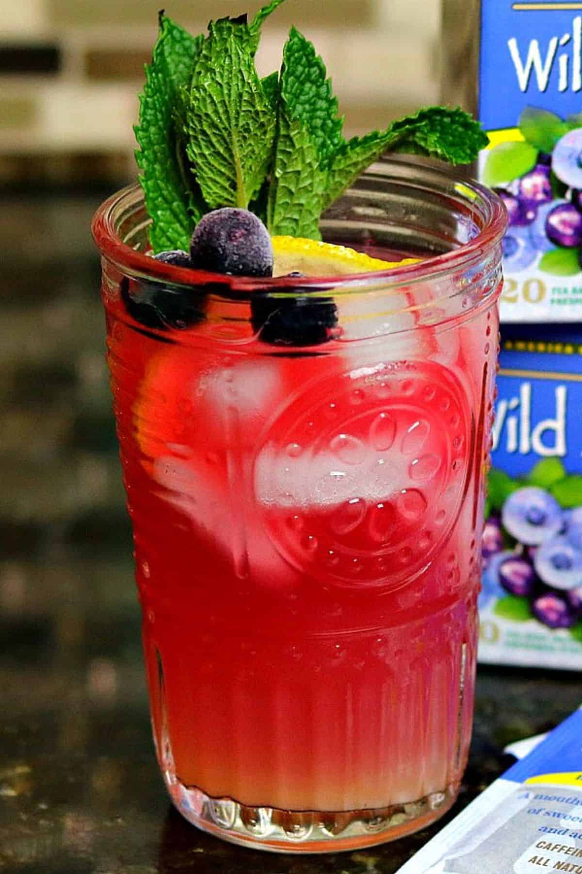 a glass of keto iced tea with blueberry herbal tea