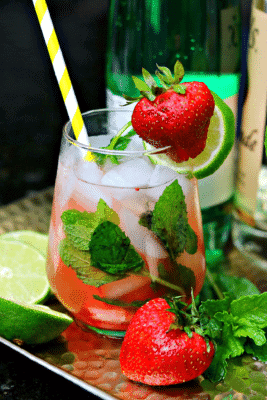 Keto Strawberry Mojito drink recipe in a glass with a straw