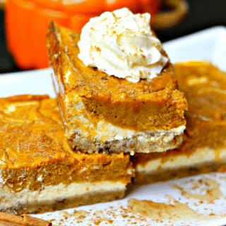 Keto Pumpkin Pie Cheesecake Bars stacked on a plate