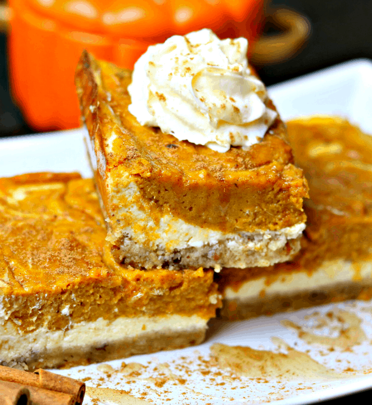 Keto Pumpkin Pie Cheesecake Bars stacked on a plate