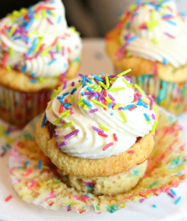 Vanilla Keto Cupcakes with sprinkles on a plate