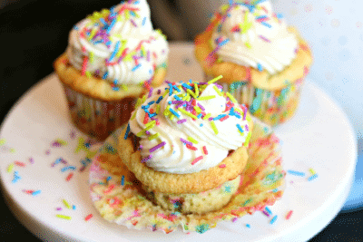 Vanilla Keto Cupcakes with sprinkles on a plate 