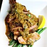 cast iron bone-in skillet pork chops on a plate ready to serve