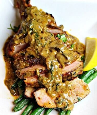 cast iron bone-in skillet pork chops on a plate ready to serve
