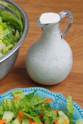 Carafe of Pickle Juice Ranch Dressing with salad