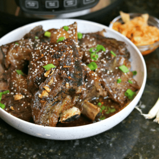 Keto Korean BBQ Ribs in a Bowl with green onions & kimchi