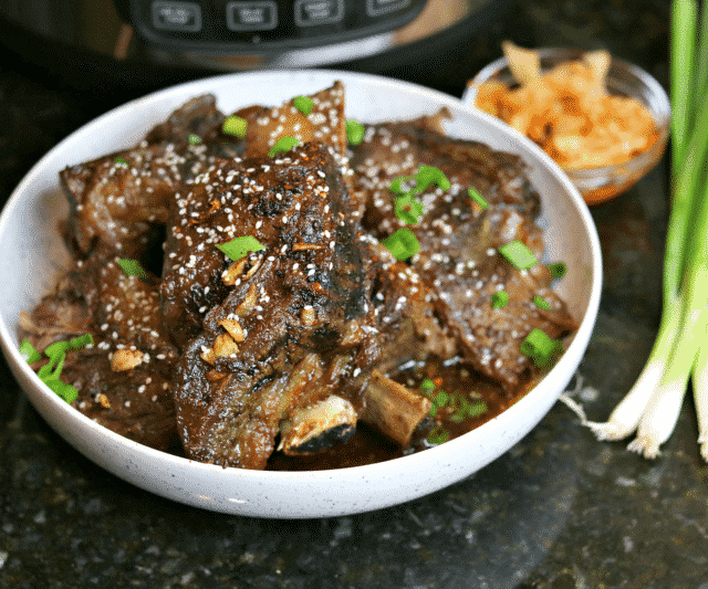 Keto Korean BBQ Ribs in a Bowl with green onions & kimchi
