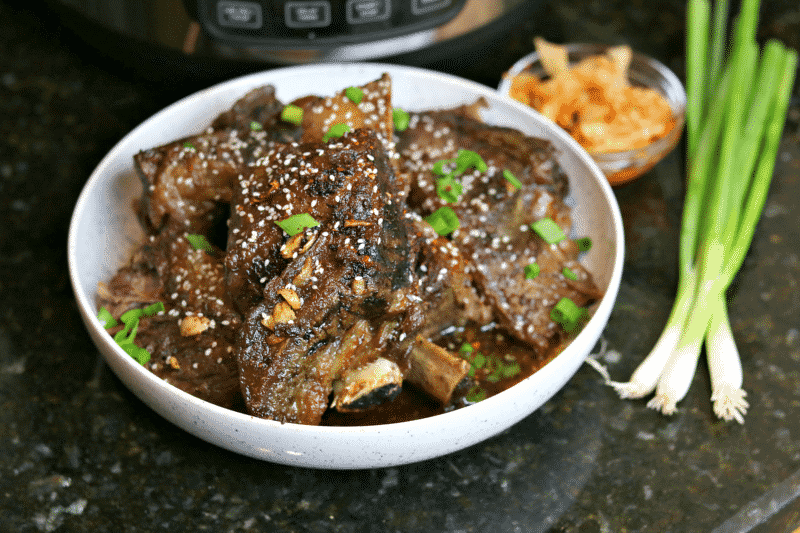 Keto Korean BBQ Ribs in a Bowl with green onions & kimchi