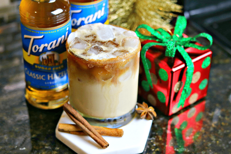 Dirty Chai Cocktail with Bourbon on a coaster with Torani Sugar Free Syrup