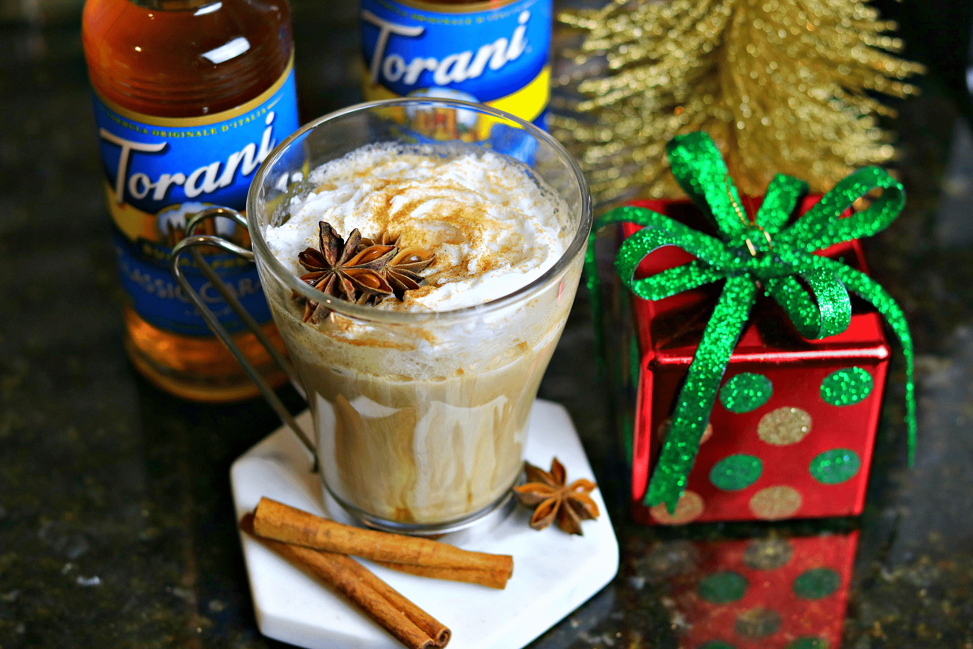 Keto Chai Latte on a coaster with holiday decorations