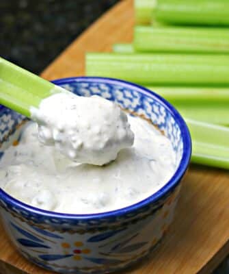 Blue Cheese Dressing in a bowl with celery