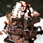Three coconut flour brownies on a plate