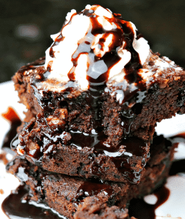 Three coconut flour brownies on a plate