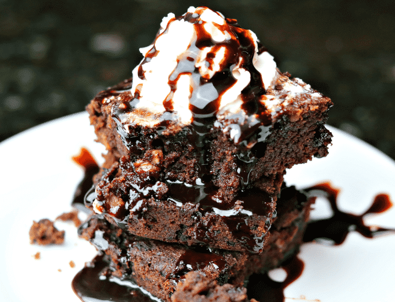 Three coconut flour brownies on a plate