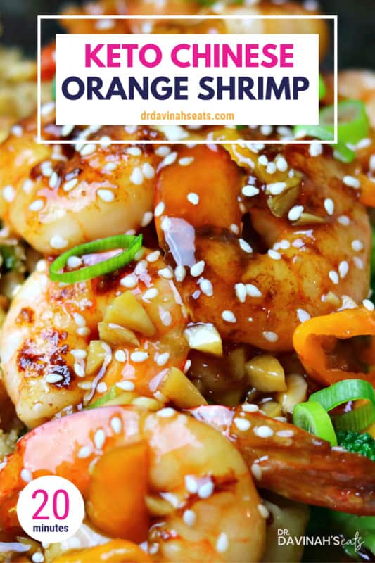 keto orange shrimp in a plate topped with sesame seeds and green onions