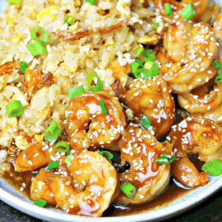 keto orange shrimp in a bowl with cauliflower rice