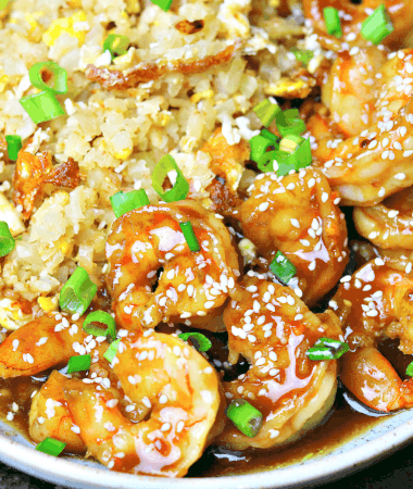 keto orange shrimp in a bowl with cauliflower rice