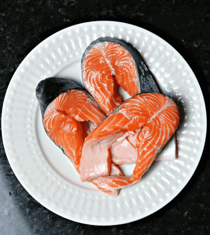 Salmon Steaks with the bones removed on a plate