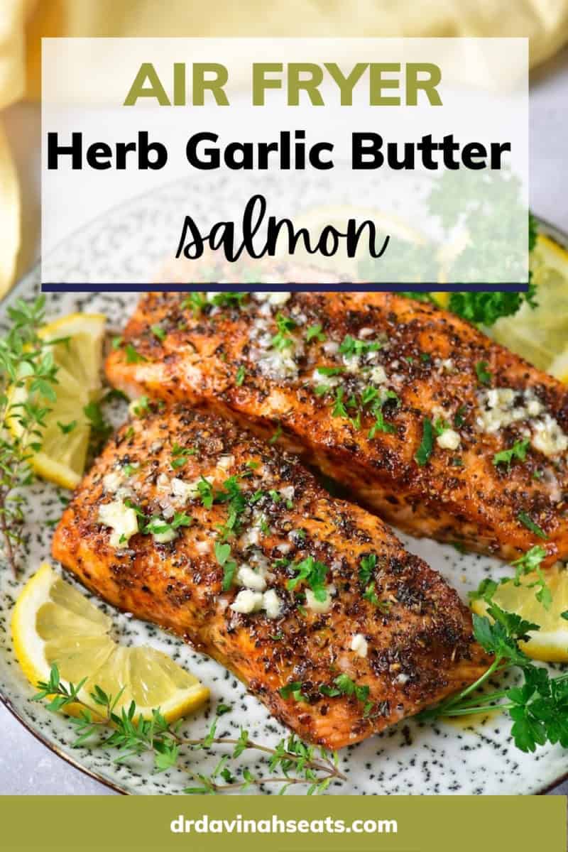 Poster with a picture of salmon filets on top of lemon slices, topped with parsley, and a banner that reads, "Air fryer herb garlic butter salmon"