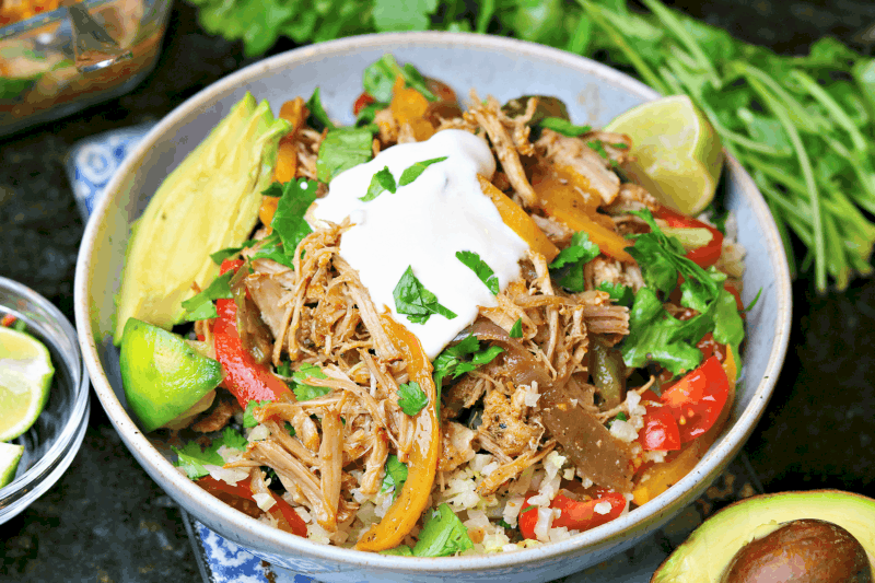 keto carnitas burrito bowl with side toppings