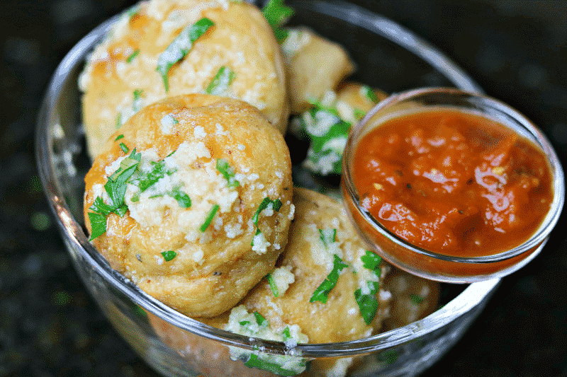 Keto Parmesan Garlic Bread Bites with a small bowl of marinara sauce