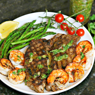 NY Strip Steak with Chimichurri and shrimp on a plate