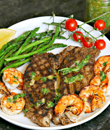 NY Strip Steak with Chimichurri and shrimp on a plate