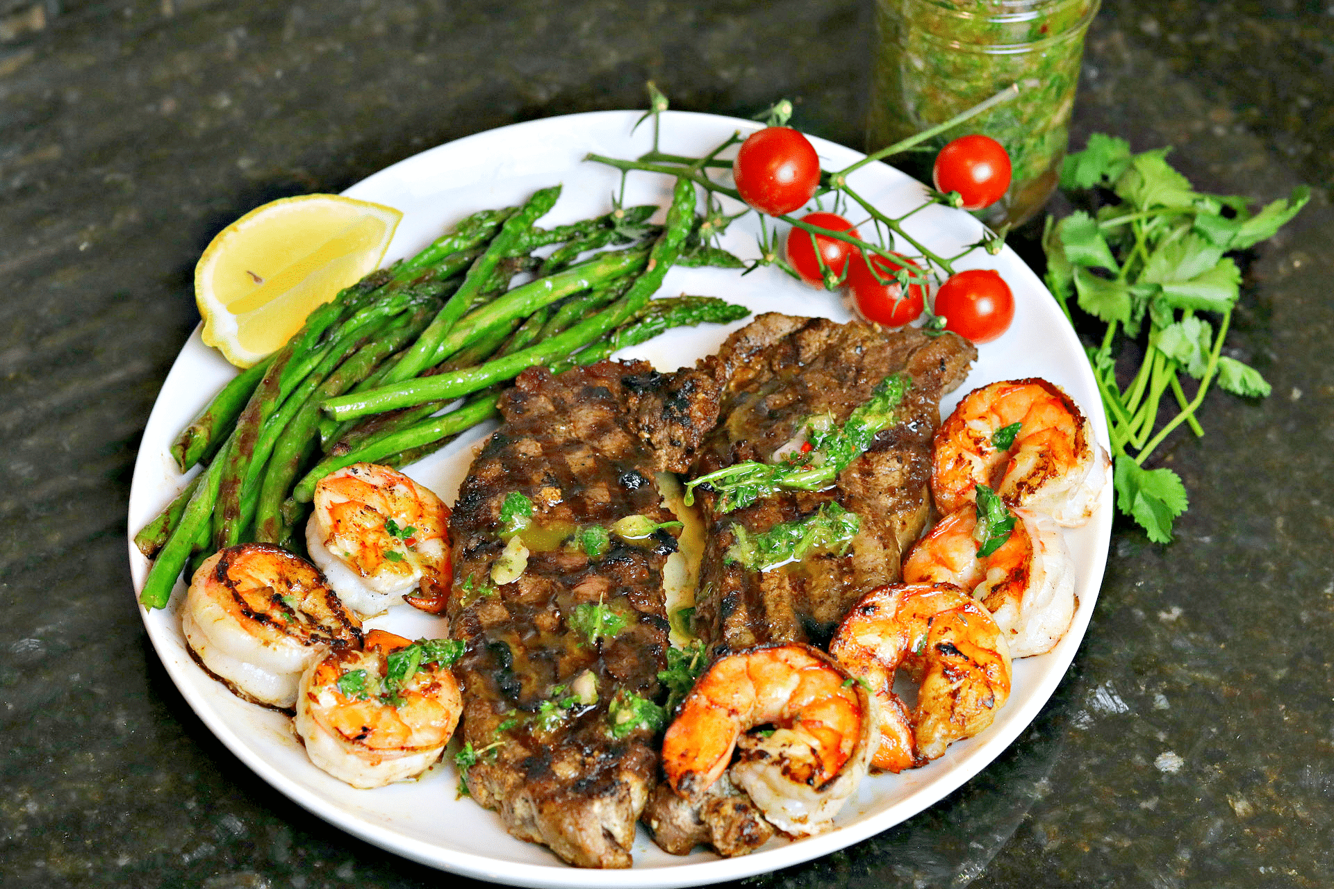 NY Strip Steak with Chimichurri and shrimp on a plate