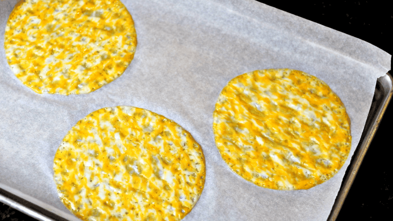 cheese shells on a baking sheet