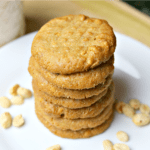keto peanut butter cookies stacked on a white plate