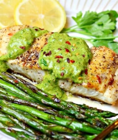pan seared halibut recipe on a plate with a form and chimichurri sauce