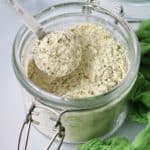 homemade keto ranch seasoning mix in a glass jar with a measuring spoon