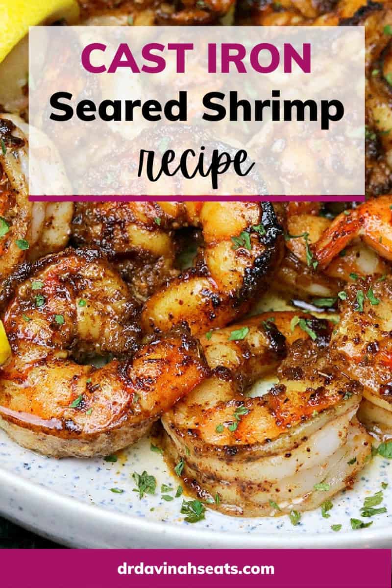 Poster with a picture of pan seared shrimp on plate with lemon and butter with a banner that says "cast iron seared shrimp recipe"