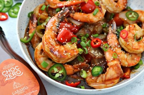 Keto Sweet and Sour Shrimp in a bowl next to ChocZero Sugar Free Syrup