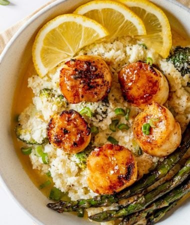 pan seared scallops in a bowl with cauliflower risotto